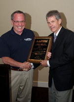 David Davidson, DPM (l) presents 2010 Robert Barnes Distinguished Service Award to Richard Bouche', DPM during the AAPSM Annual Membership Meeting in Seattle, Washington