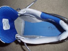 A strobel lasted shoe has stitching around the edge of the footbed